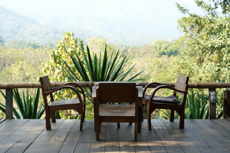solid teak timber lounge chair set with mountain background